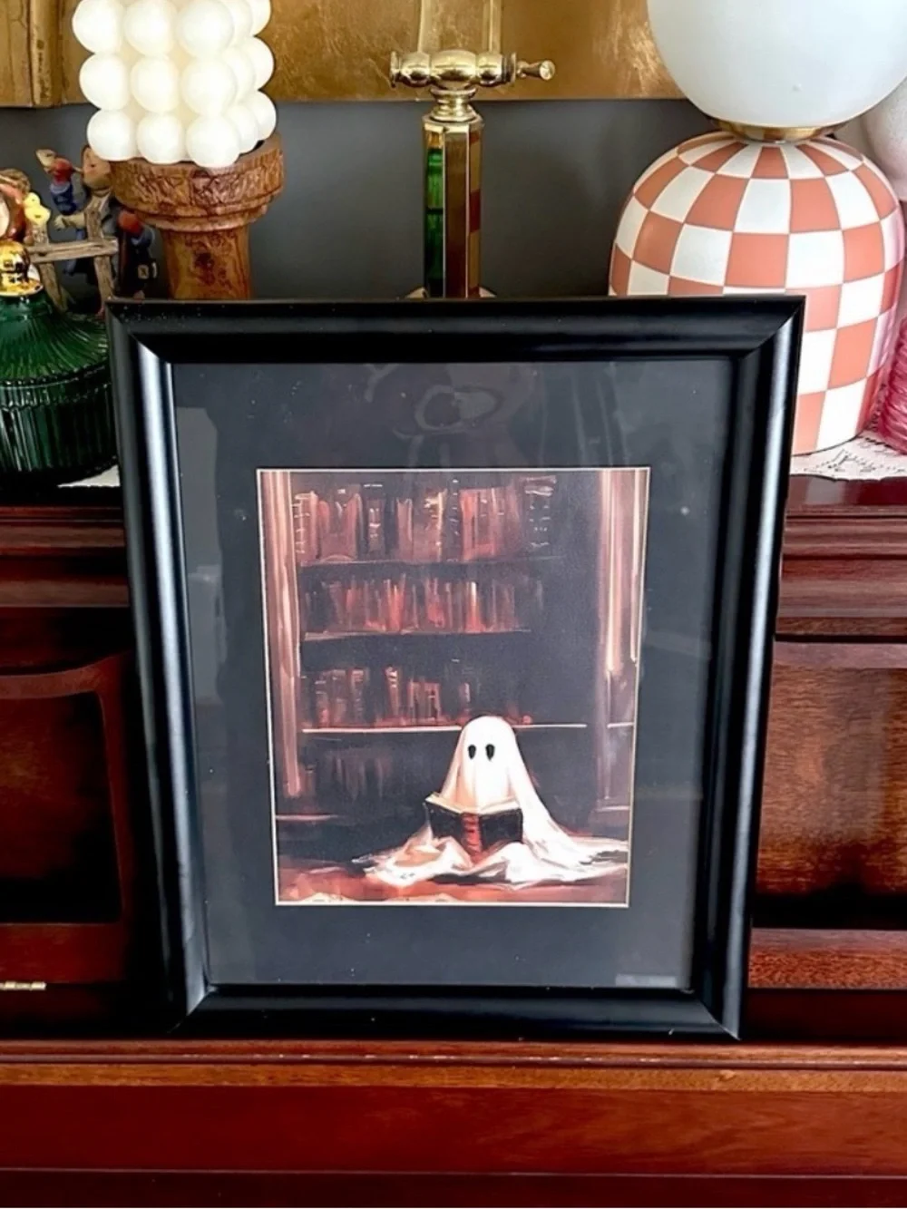 Cute Spooky Ghost Reading a Book in a Library Canvas Print Black Framed Wall Art
